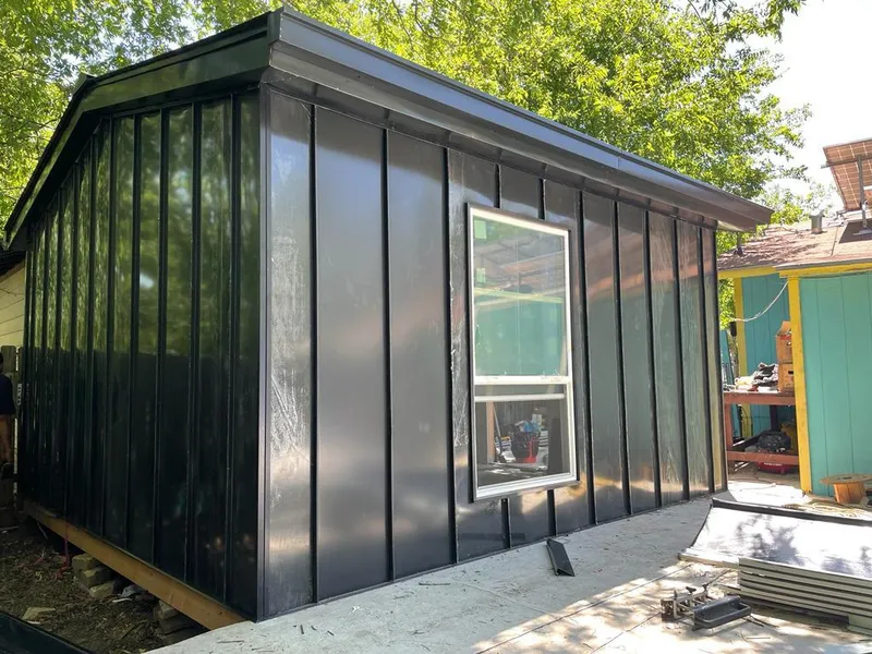 Black standing seam metal wall panels for Roof Inspection in Bradford